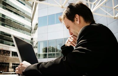 Businessman On Computer Outside