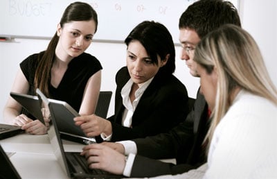 Businesswoman Pointing Computer