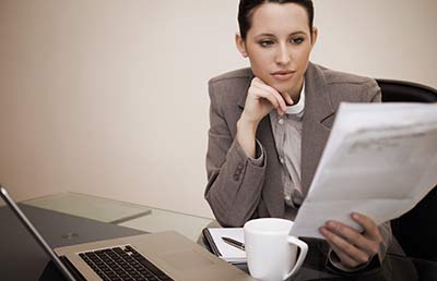 BusinesswomanReadingContract