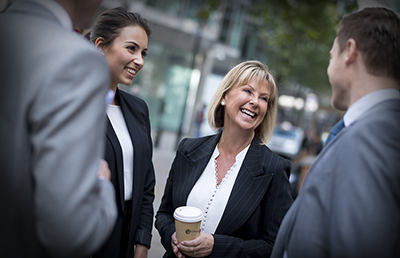 Professionals Conversation on Sidewalk