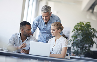 Three Discussion Laptop Two Sitting One Standing