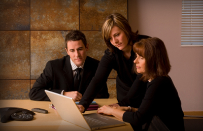 Three People Conference Table Laptop