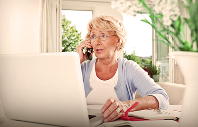 Woman at Home Laptop Phone Planner