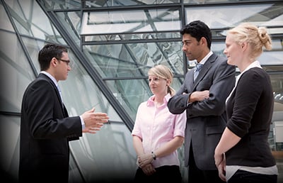 Young Man Leading Discussion Atrium