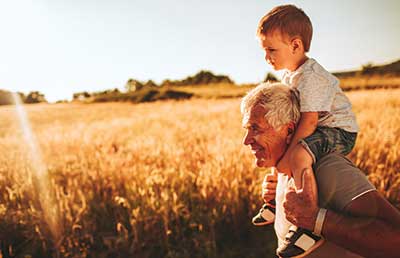 Granpa-Giving-Piggy-Back-Ride-to-Grandson.jpg