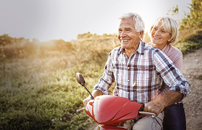 Senior Couple On A Motorbike