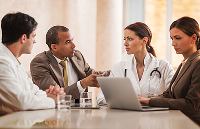 Doctors and Business People Talking in Meeting