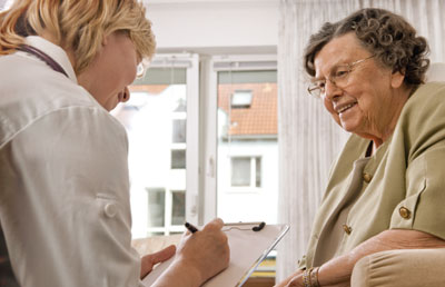 Medical Worker with Chart Reviewing with Senior