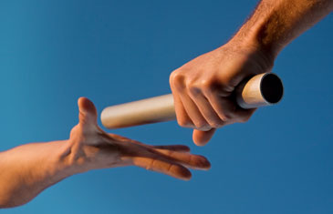 Two Hands Passing Relay Baton