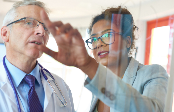 Two doctors viewing data