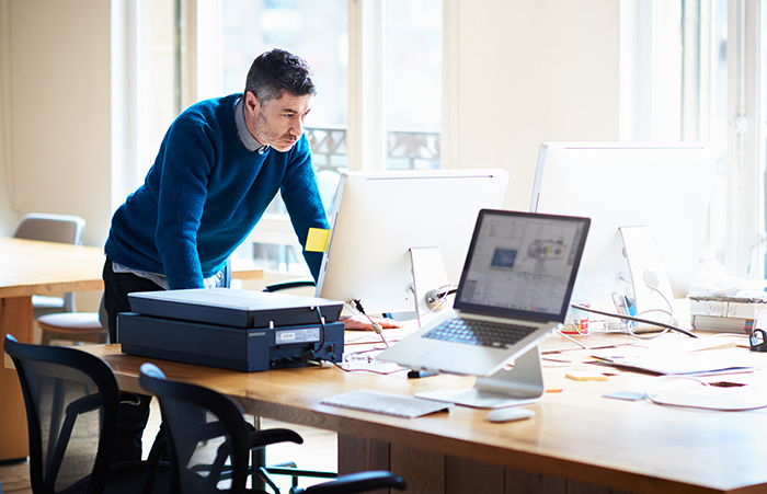 Man looking at computer monitor